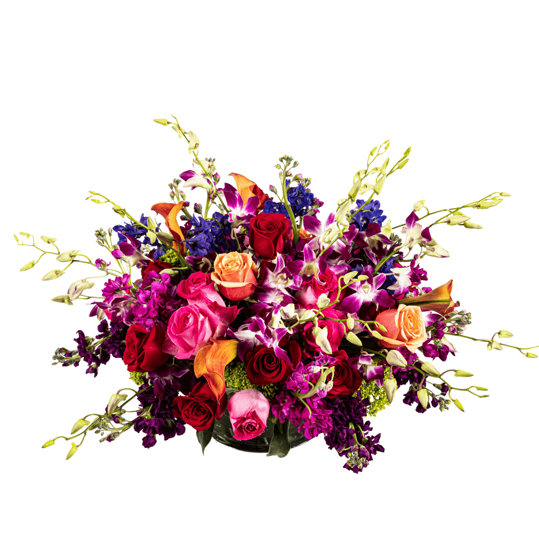 Large and low colorful floral arrangement featuring Orchids and Roses