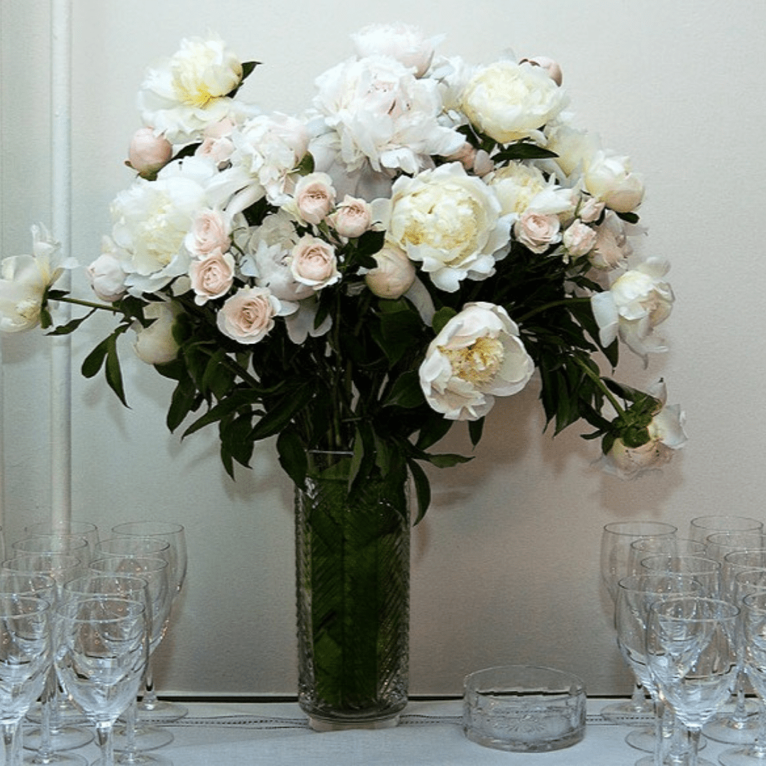 Luxurious elegant floral arrangement featuring white and pink Peonies, Roses and Spray Roses