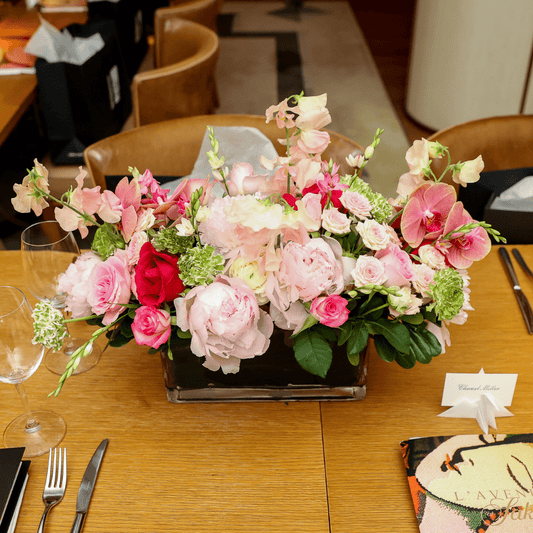 Large luxe pink rectangular centerpiece featuring Peonies, Orchids and Roses