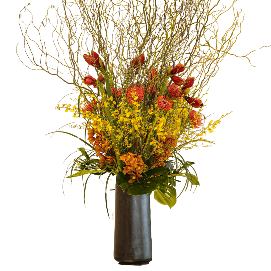 Large and luxurious lobby floral arrangement featuring Orchids, Amaryllis and Protea