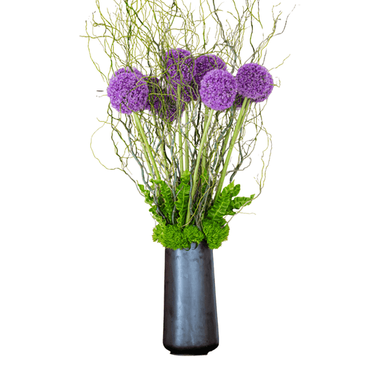 Large lobby floral arrangement featuring purple Allium
