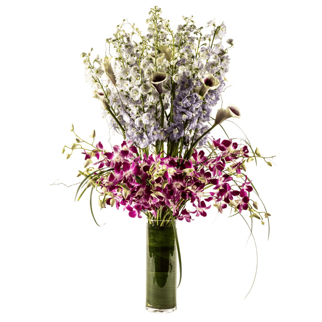 Medium floral arrangement featuring Delphinium, mini Calla Lilies and Orchids