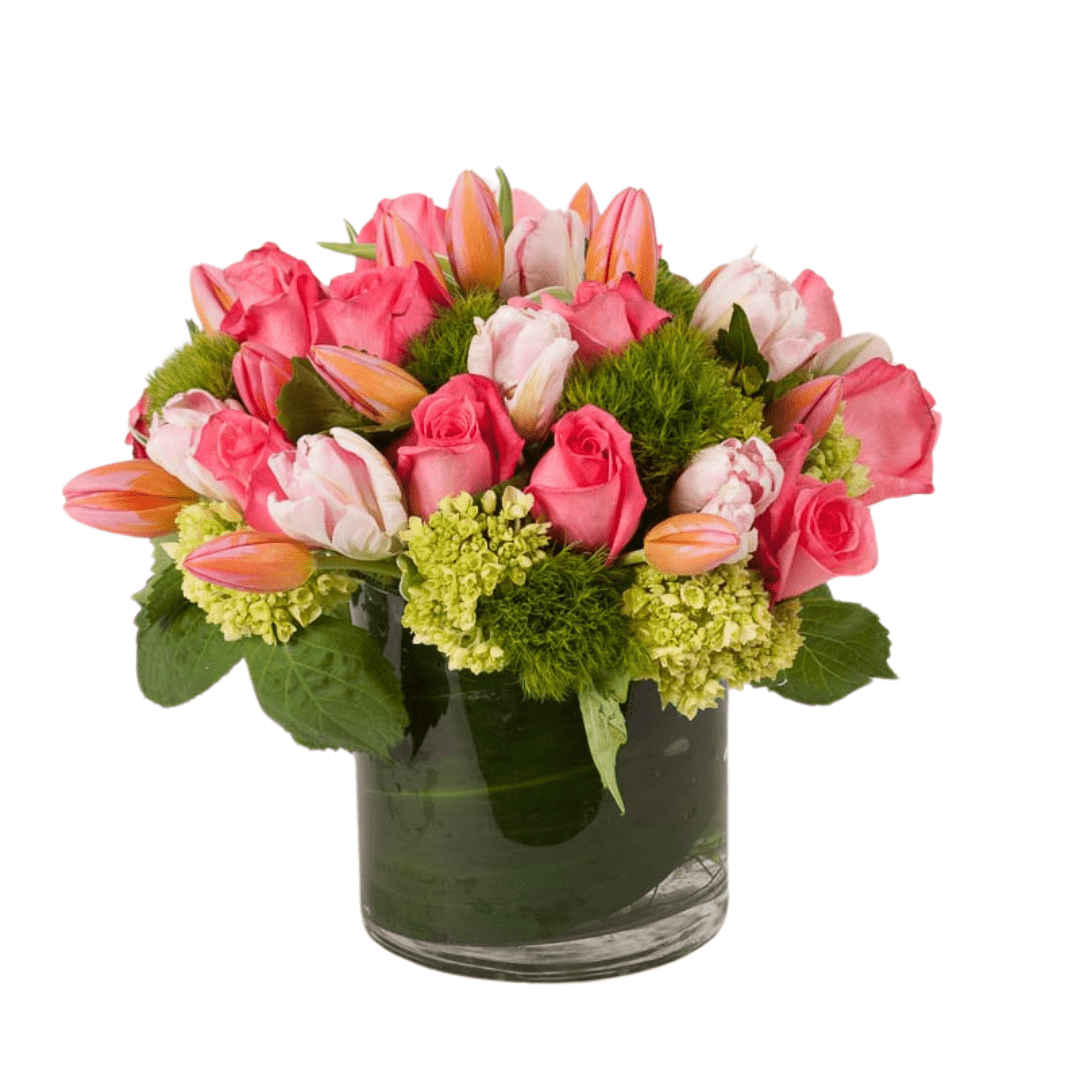 Floral arrangement featuring tulips and pink roses