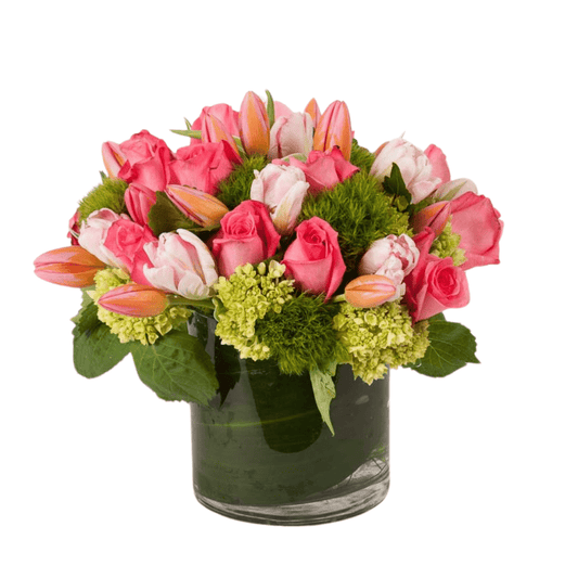 Floral arrangement featuring tulips and pink roses
